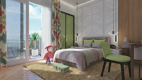 Child's bedroom with a green chair, play rug, and balcony doors with city view