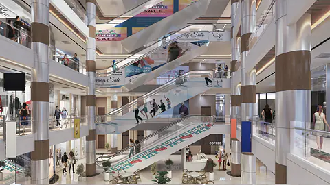 Multi-level mall atrium with escalators, galleries, timber-banded columns and a cafe at ground level